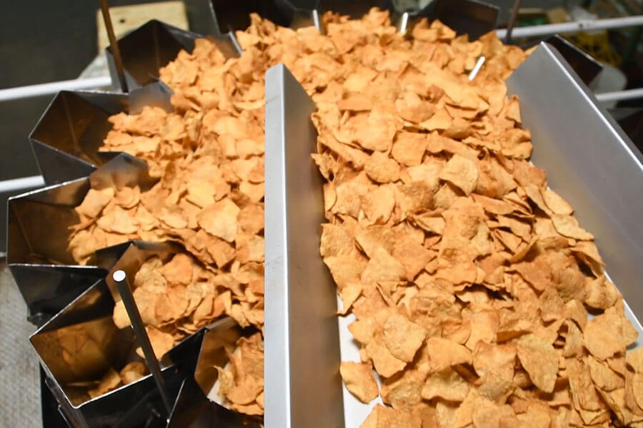 Outlaw Snax tortilla chips traveling through the production line at the Ocala, Florida manufacturing facility.